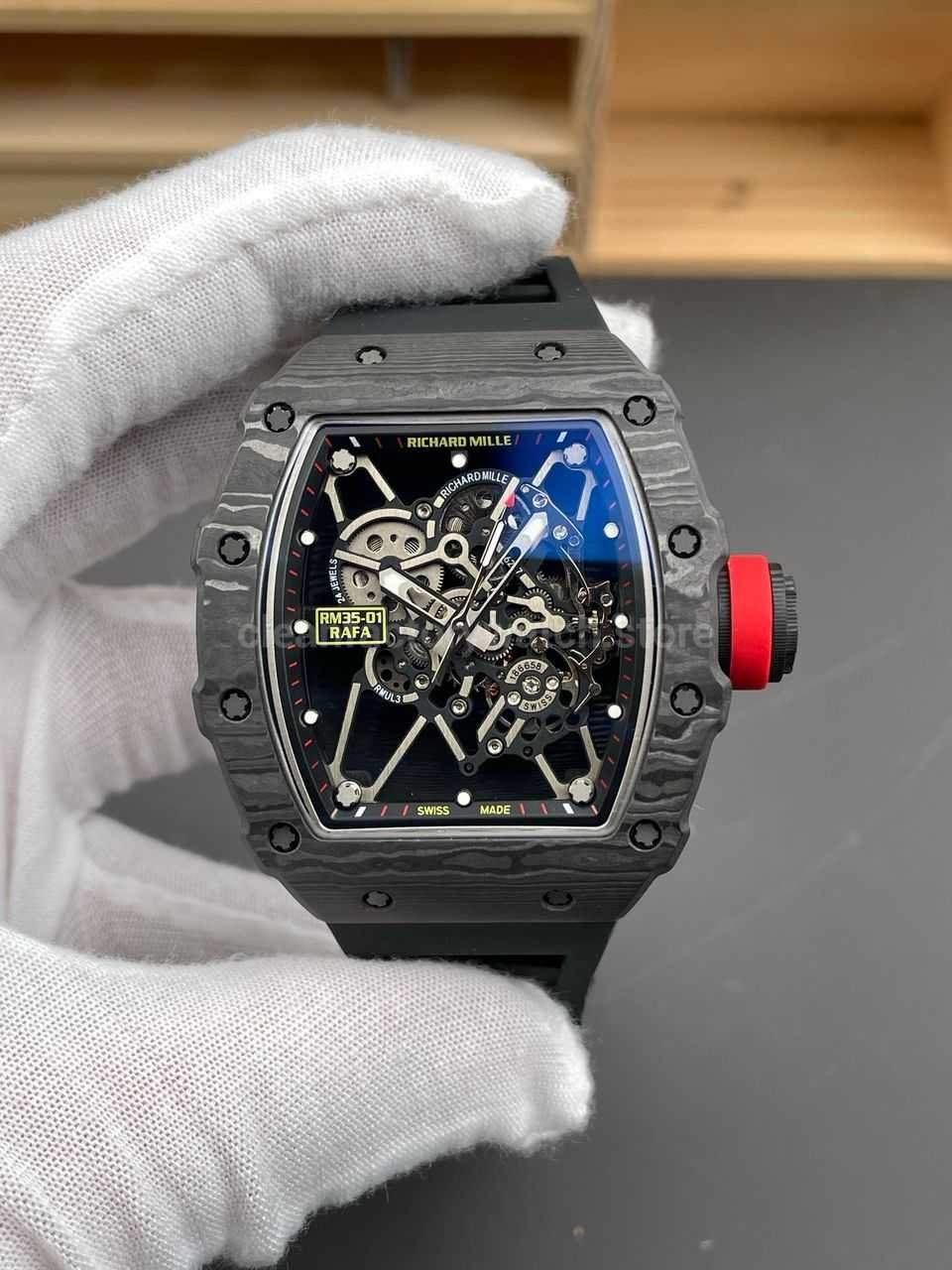 Classic New Factory RM 35-01 replica watch with black carbon fiber case, black rubber strap and black skeletonized dial.
