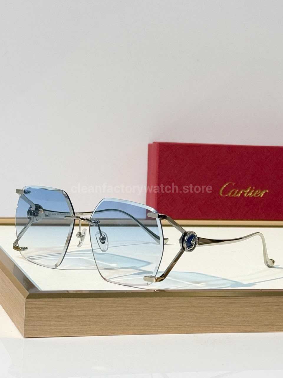 Cartier CT7194S Rimless Sunglasses | Silver-Tone Temples, Blue Circular Accents & Blue Gradient Lenses  Product Description
