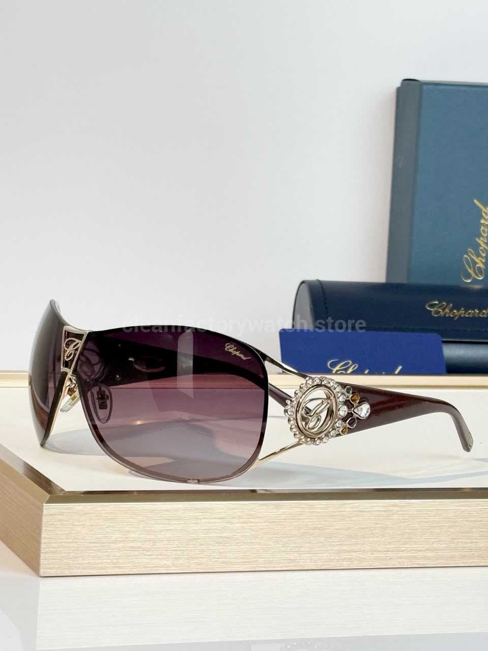 Chopard SCH863S Shield Sunglasses | Gold & Burgundy Frame with Purple-Red Gradient Lens