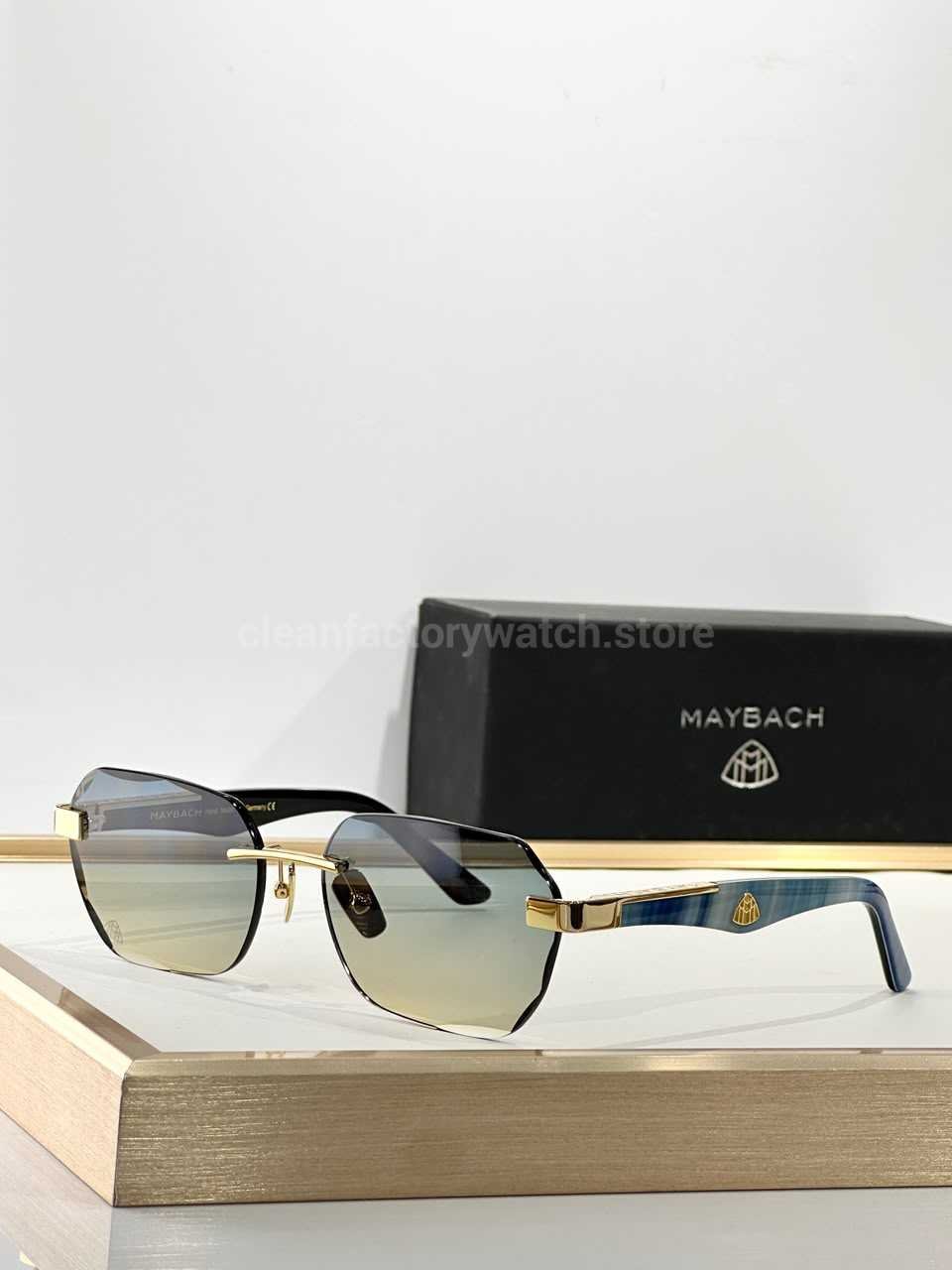 Maybach The Arttai Rimless Sunglasses Gold Tone Frame With Blue Marbled Temples And Grey Gradient Lenses (1) Maybach The Arttai Rimless Sunglasses | Gold-Tone Frame with Blue Marbled Temples and Grey Gradient Lenses - Image 1